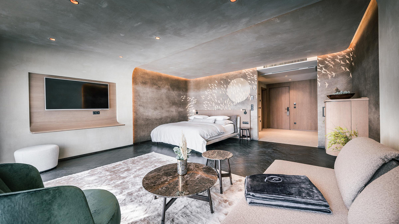 Doppelzimmer und Aufenthaltsraum - Nature Suite - Quellenhof See Lodge