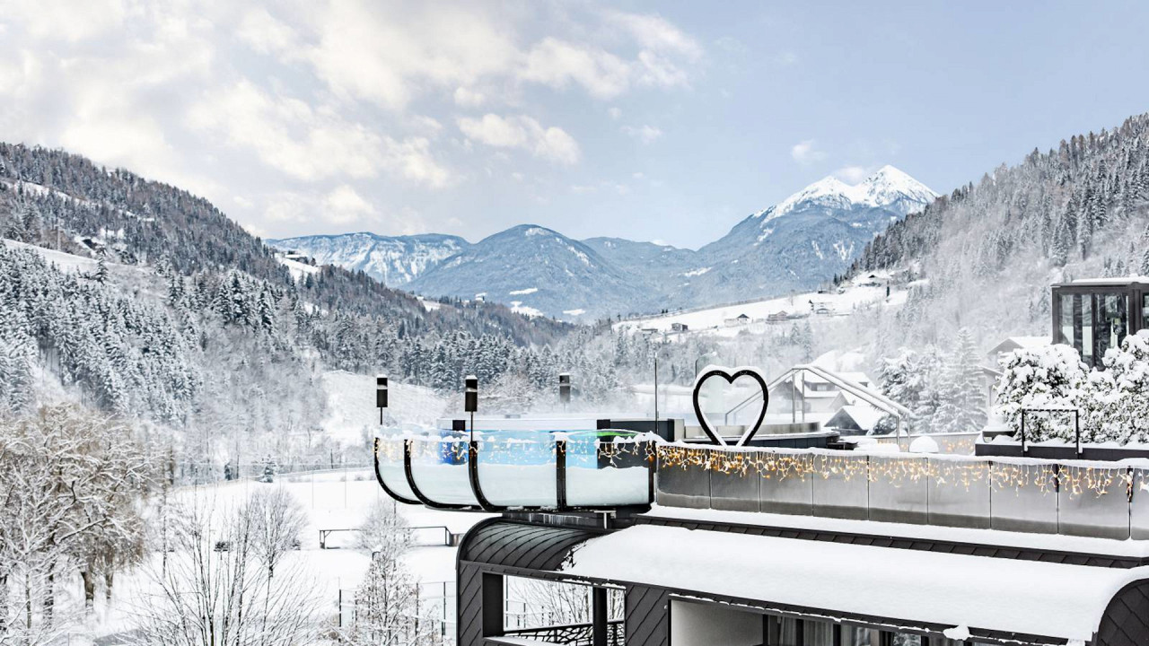 Outdoor swimming pool winter Quellenhof Luxury Resort Passeier